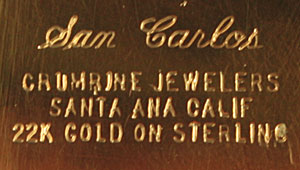 Marque Crumrine gravée au dos des boucles de ceinture américaines western country en or et argent massif.