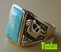 A Kokopelli Indian native american tribal symbol is on this sterling and blue turquoise men's ring