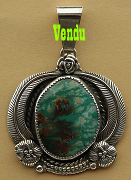 Pendentif Navajo turquoise et symboles amérindiens, bijou ethnique en argent.