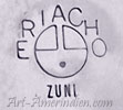 Eriacho over a sun face symbol is Tony & Ola Eriacho Zuni hallmark on jewelry