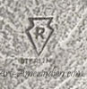 R inside arrowhead mark on Indian jewelry for Ernest Rangel Navajo