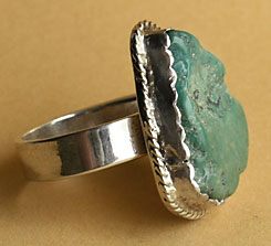 South Western sterling silver ring with a rough turquoise gemm serrated, ring made in USA, signed by American Artist