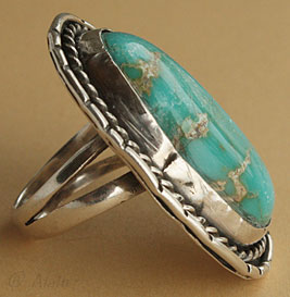 Navajo ring with sterling silver rope around a turquoise