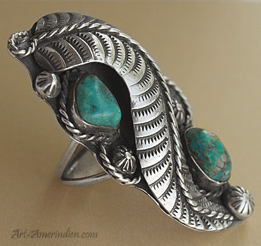 2 turquoises and a large sterling feather are on this Navajo old pawn ring