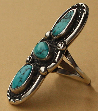 Navajo ethnic ring with 3 serrated turquoises, rope, silver drops