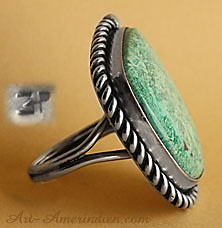A green and gorgeous Arizona turquoise is serrated on this Navajo native american indian ring