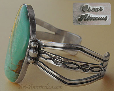 A gorgeous turquoise is serrated on this Indian Native American Navajo sterling bracelet signed Oscar Alexius