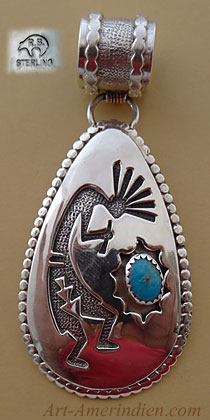 Pendentif amérindien Navajo en argent avec turquoise représentant un Kokopelli Dancer