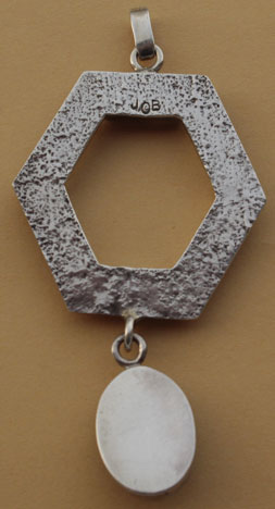 Navajo artist Jason Beagay signed this tuffa cast sterling silver and Onyx gemm pendant