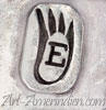 E inside a bear paw hallmark