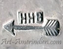 HHB over a left pointing arraow mark on jewelry is Harry H. Begay Navajo