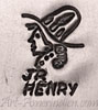 JR HENRY under a head mark on indian jewelry is George Henry Jr Navajo artist, husband of Nusie Henry-Belon