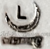 Crescent moon shape with letter L is Lane Tsosie Navajo hallmark